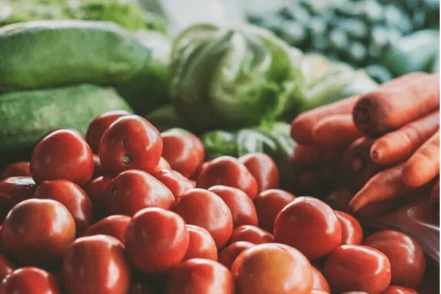 Open Farm Market with Tomatoes, Cucumbers and carrots on table